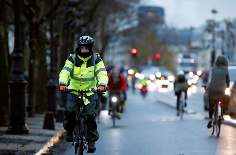 People ride bicycles as a strike by all unions of the Paris transport network (RATP) and French SNCF workers entered its seventh consecutive day in Paris