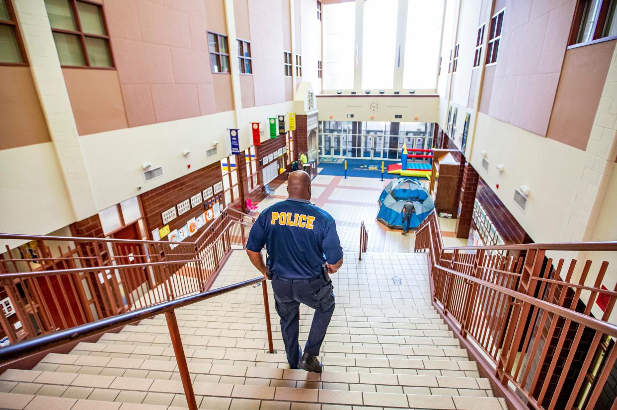 Anthony Pearson, school resource officer at Riley High School, walks down the main staircase on Friday, May 21, 2021.