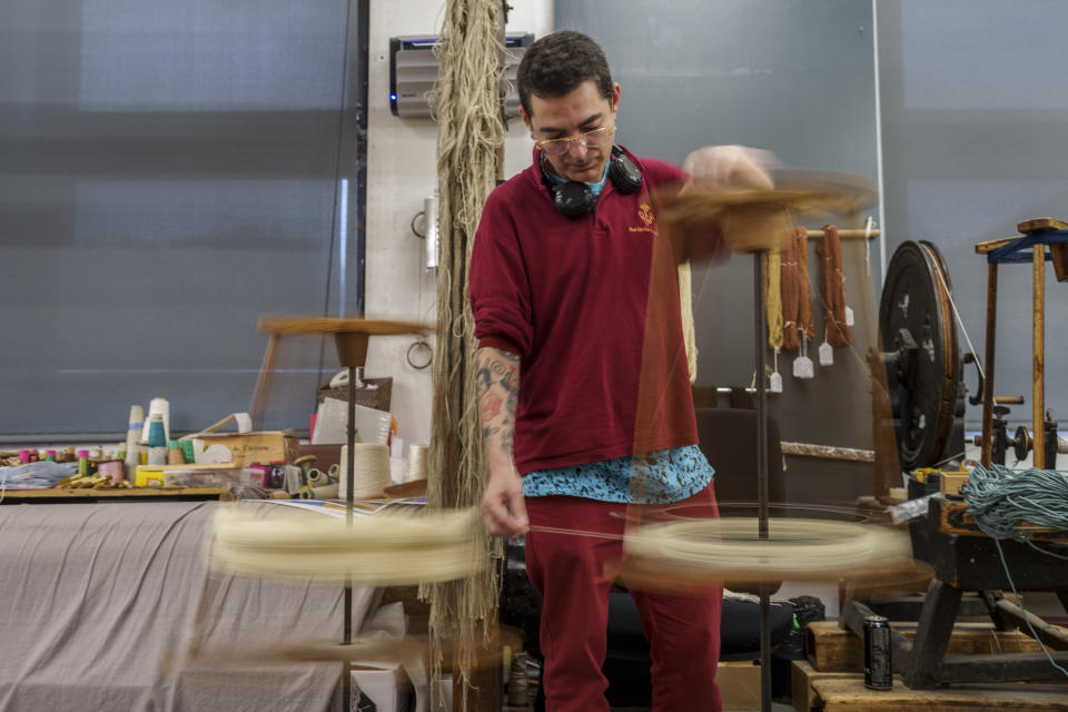 A craftsman works at the Royal Tapestry Factory in Madrid, Spain, Friday, Nov. 30, 2023. Since its foundation in 1721, the Royal Tapestry Factory of Madrid has not stopped producing. It was Philip V, then King of Spain, who had the factory built with the help of Catholic craftsmen from Flanders to replace the lack of private initiative that existed at the time. (AP Photo/Manu Fernandez)