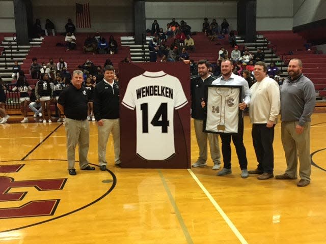 Former South Effingham High School baseball star J.B. Wendelken, now playing with the Arizona Diamondbacks, holds up his Mustangs No. 14 jersey. Wendelken’s number was retired during a ceremony at halftime of the Mustangs’ basketball game against Statesboro on Dec. 14.