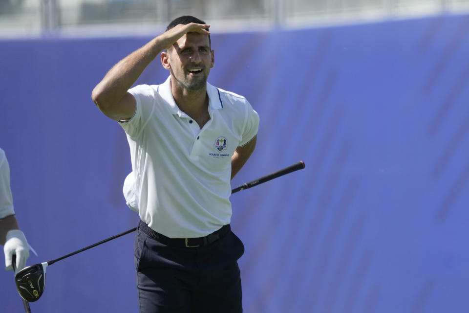 World number 1 tennis player Novak Djokovic looks for his ball after playing off the 1st tee during an all stars golf match between Team Colin Montgomerie and Team Cory Pavin at the Marco Simone Golf Club in Guidonia Montecelio, Italy, Wednesday, Sept. 27, 2023. The Ryder Cup starts Sept. 29, at the Marco Simone Golf Club. (AP Photo/Andrew Medichini)