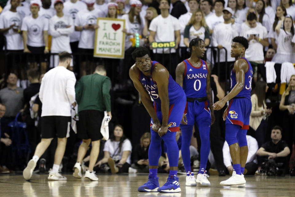 Kansas center Udoka Azubuike looks up at the scoreboard during a timeout in the second half of an NCAA college basketball game against Baylor on Saturday, Feb. 22, 2020, in Waco, Texas. (AP Photo/Ray Carlin)