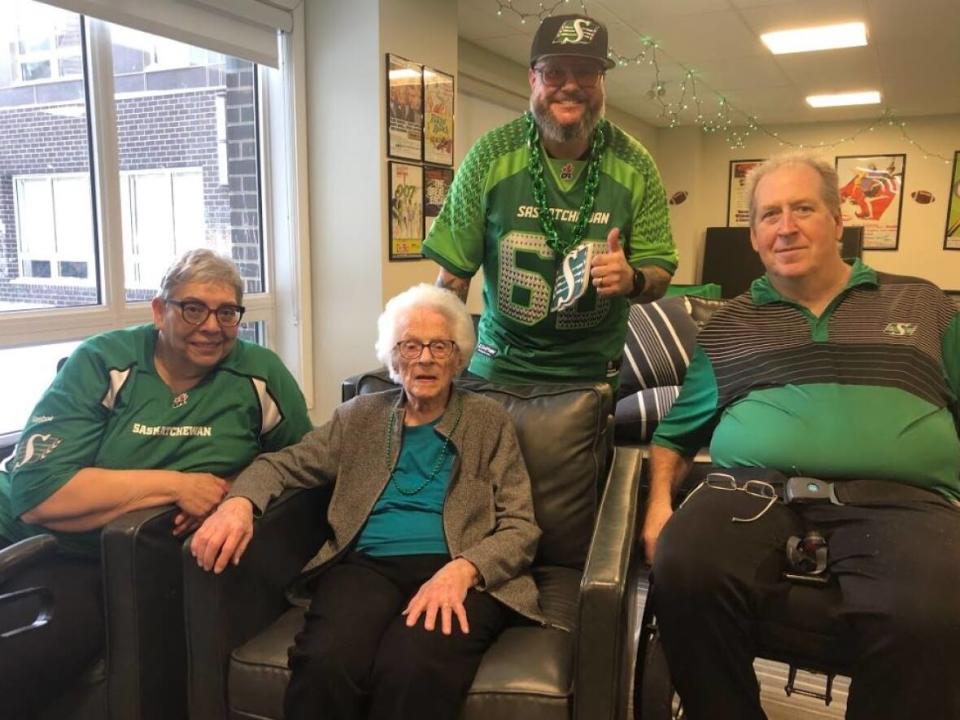 (From left) Wendy Mitchell, Laurette Parent, Jansen Anderson and Tim Shawenberg all had the Grey Cup spirit this week at Harbour Landing Village in Regina. (Peter Mills/CBC News - image credit)