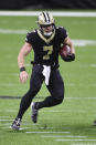 New Orleans Saints quarterback Taysom Hill (7) carries the ball during an NFL game against the San Francisco 49ers, Sunday, Nov. 15, 2020 in New Orleans. The Saints defeated the 49ers 27-13. (Margaret Bowles via AP)