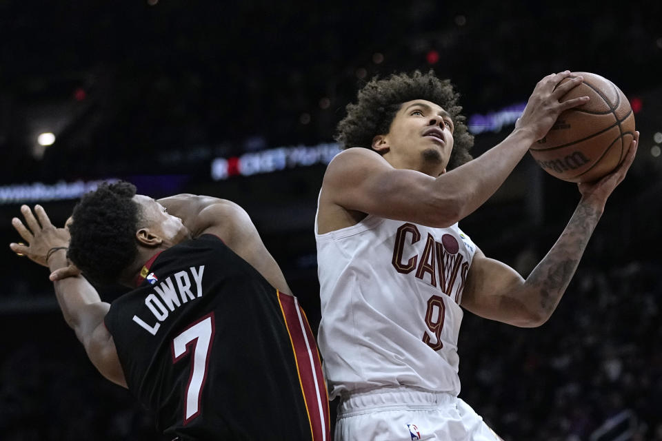 Cleveland Cavaliers guard Craig Porter (9) goes to the basket past Miami Heat guard Kyle Lowry (7) in the second half of an NBA basketball game Wednesday, Nov. 22, 2023, in Cleveland. (AP Photo/Sue Ogrocki)