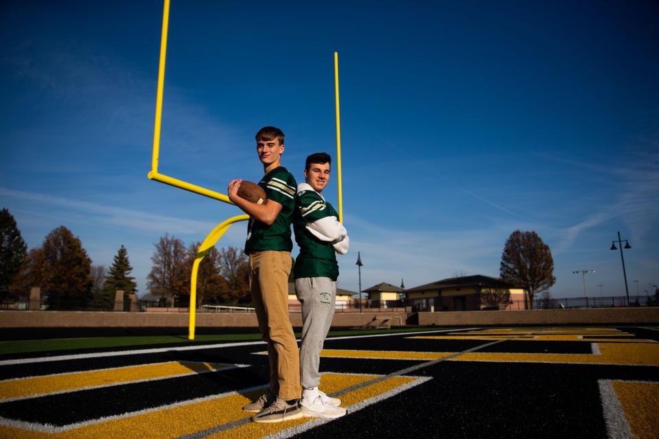 West's Skyler Geurink and Parker Holman pose for a portrait Tuesday, Nov. 29, 2022, at Zeeland Stadium. The two have been named the Sentinel's Football Players of The Year. 