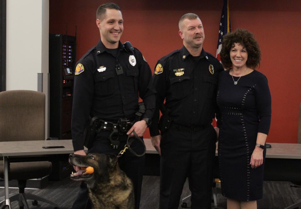 Apollo (bottom left) has officially retired form the Lebanon City Police department after serving nine years with his partner Patrolman First Class Sean Buck (left).
