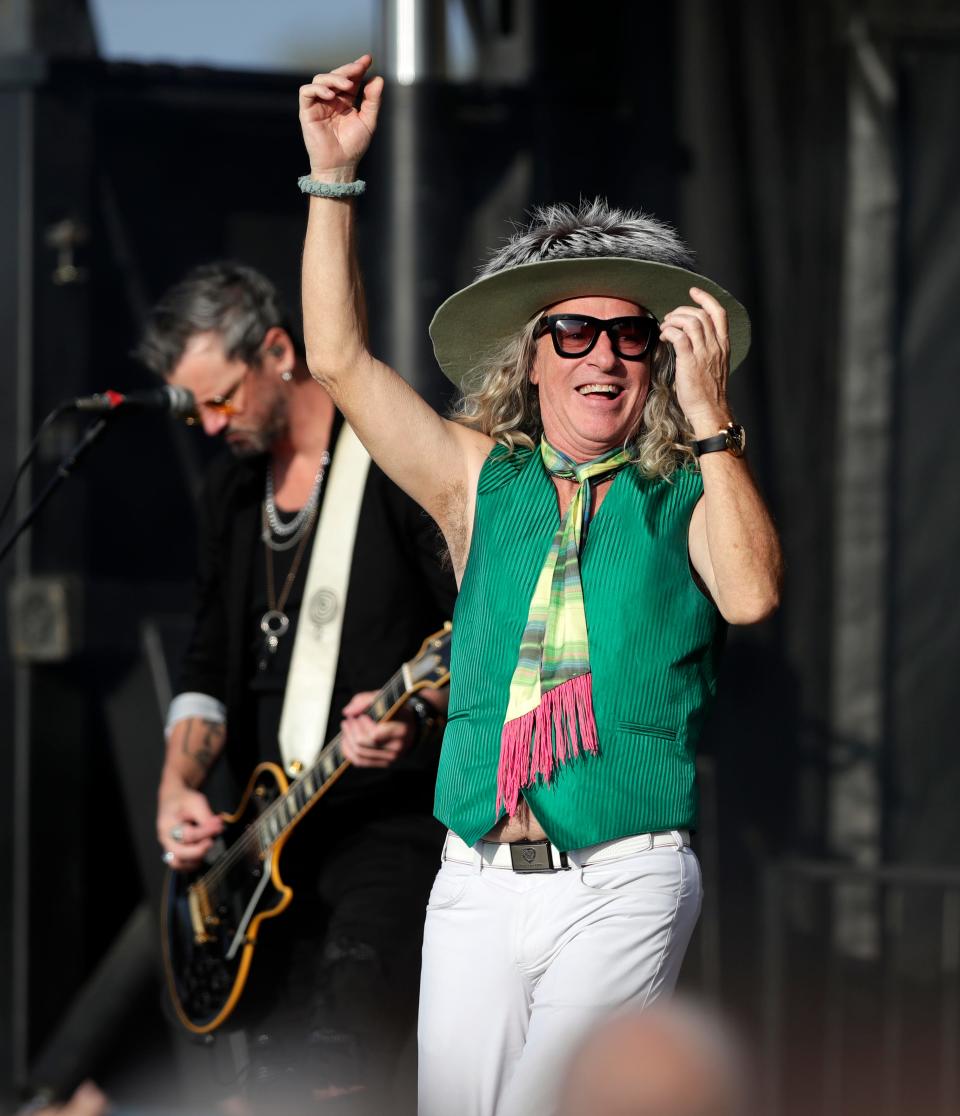 Ed Roland, lead singer of Collective Soul, performs during the Green Bay Packers' Kickoff Weekend concert on Saturday outside Lambeau Field. He ditched the hat and donned a Packers jersey later in the set.