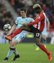 <p>Burnley’s Joey Barton, left and Sunderland’s Didier Ibrahim Ndong battle for the ball, during the English Premier League soccer match between Sunderland and Burnley </p>