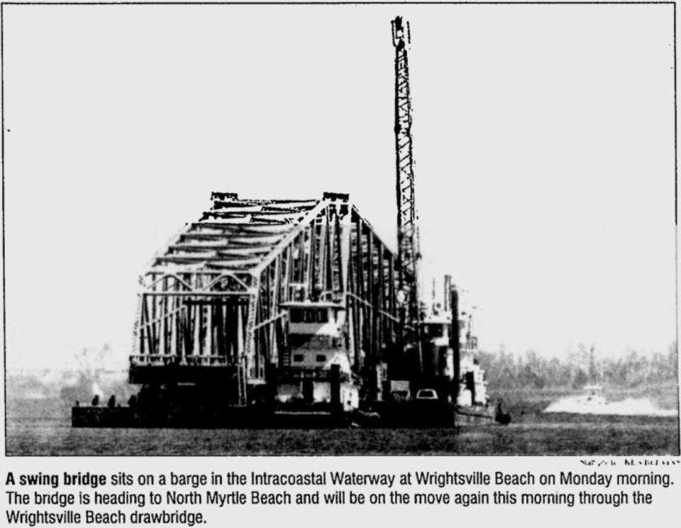 A swing bridge sat atop a barge in the Intracoastal Waterway at Wrightsville Beach in 2000. The bridge was in transit to North Myrtle Beach.