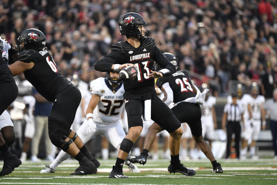 Louisville quarterback Jack Plummer (13) looks for a receiver during the first half of the team's NCAA college football game against Murray State in Louisville, Ky., Thursday, Sept. 7, 2023. (AP Photo/Timothy D. Easley)