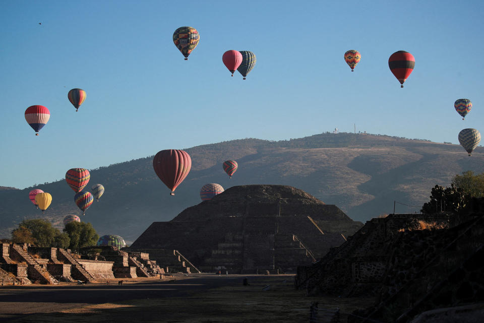 The Pyramid of the Moon is seen on the day of the spring equinox as hot air balloons float above the precolonial city of Teotihuacan on the outskirts of Mexico City, Mexico, on March 20, 2023. 