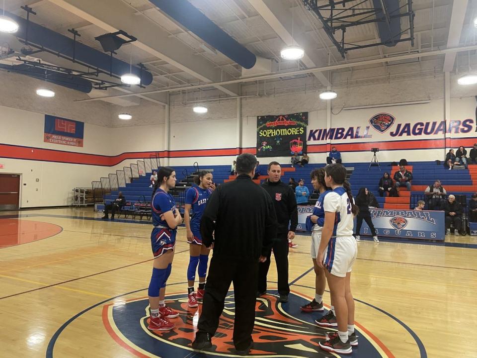 East Union and Kimball's girls basketball team captains meet at the center of court ahead of a game on Tuesday, Jan. 24.