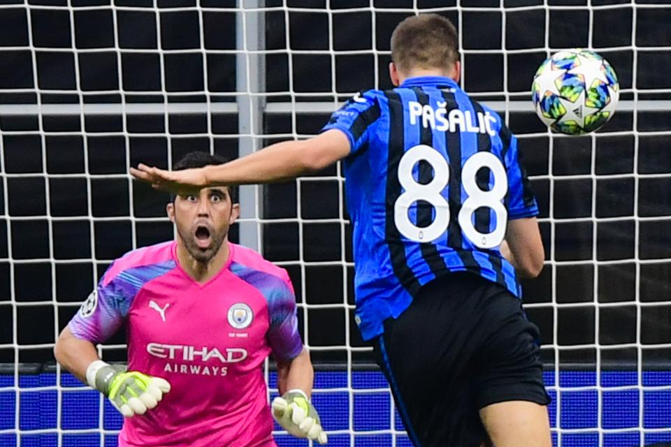 Atalanta's Croatian midfielder Mario Pasalic (R) scores a header past Manchester City's Brazilian goalkeeper Ederson to equalize during the UEFA Champions League Group C football match Atalanta Bergamo vs Manchester City on November 6, 2019 at the San Siro stadium in Milan. (Photo by Miguel MEDINA / AFP) (Photo by MIGUEL MEDINA/AFP via Getty Images)