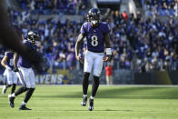 Baltimore Ravens quarterback Lamar Jackson reacts after throwing a touchdown pass to wide receiver Marquise Brown, not visible, during the second half of an NFL football game against the Cincinnati Bengals, Sunday, Oct. 24, 2021, in Baltimore. (AP Photo/Nick Wass)