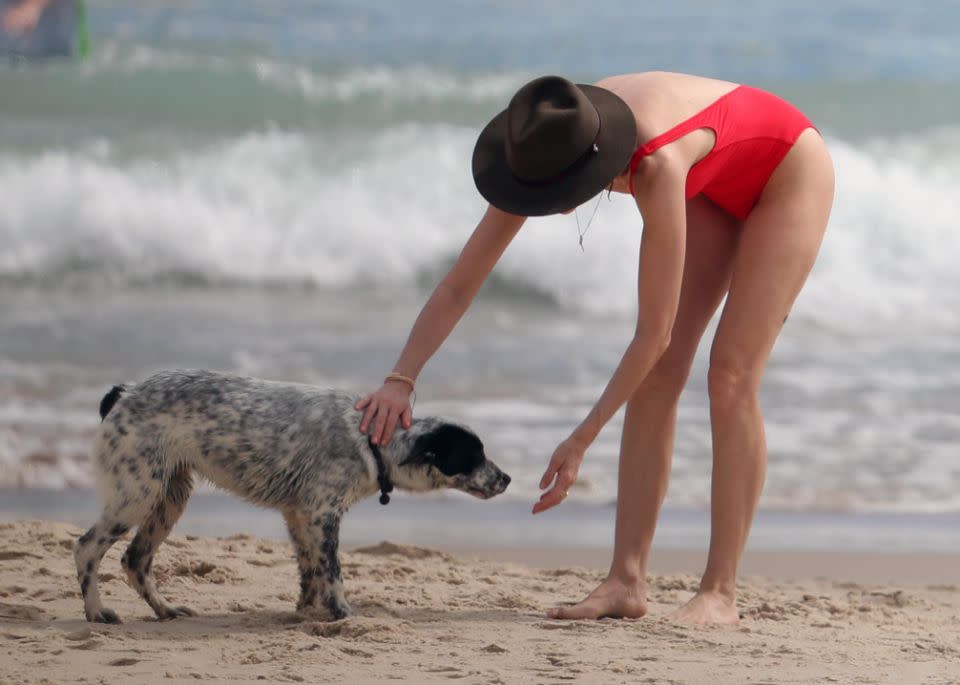 Naomi stopped to pat a dog. Photo: Diimex