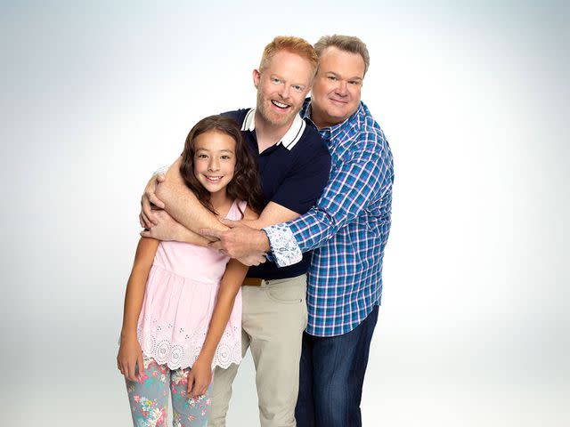 <p>Robert Ashcroft/getty</p> Walt Disney Television via Getty Images's "Modern Family" stars Aubrey Anderson-Emmons as Lily Tucker-Pritchett, Jesse Tyler Ferguson as Mitchell Pritchett, and Eric Stonestreet as Cameron Tucker.