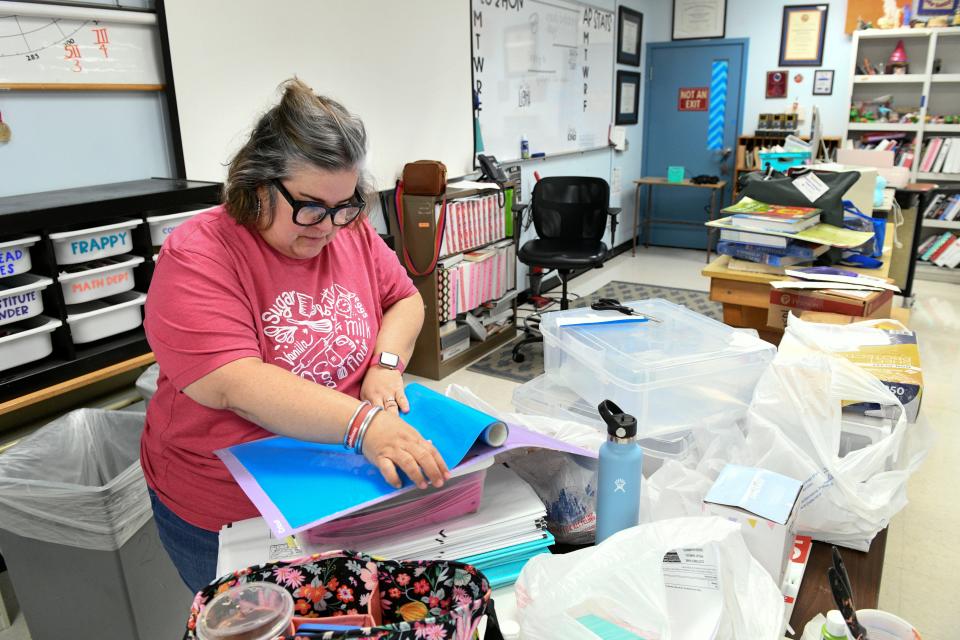 Fort Walton Beach High School Teacher Jackie Sheffield works to prepare her classroom for the upcoming school year, which begins next Wednesday, Aug. 10. Sheffield, who teaches Algebra II Honors and AP Statistics, is herself a graduate of Fort Walton Beach High School and this will be her 22nd year teaching there.