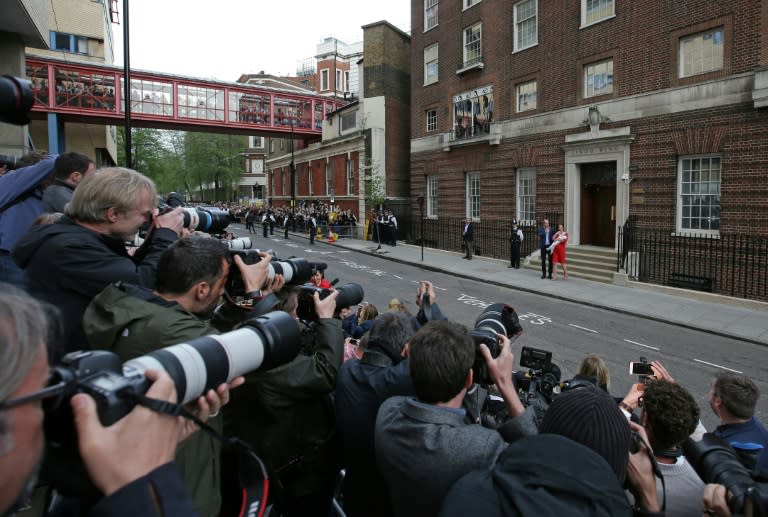 Britain's Prince William, Duke of Cambridge (L) and Britain's Catherine, Duchess of Cambridge present their newly-born son, their third child, to the media outside the Lindo Wing at St Mary's Hospital in central London