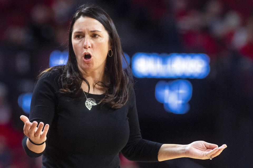 FILE. - Nebraska head coach Amy Williams reacts after a call against her team as they take on Samford in the third quarter of an NCAA college basketball game Saturday, Dec. 10, 2022, in Lincoln, Neb. A former Nebraska women's basketball player alleges coach Williams and athletic director Trev Alberts did not take appropriate action when her sexual relationship with an assistant coach became widely known. Ashley Scoggin filed a civil lawsuit on Sunday, Feb. 18, 2024, in U.S. District Court describing how Chuck Love allegedly took a special interest in her and how the relationship turned sexual and caused Scoggin to fear retaliation if she refused to engage in it. (Kenneth Ferriera/Lincoln Journal Star via AP, File)