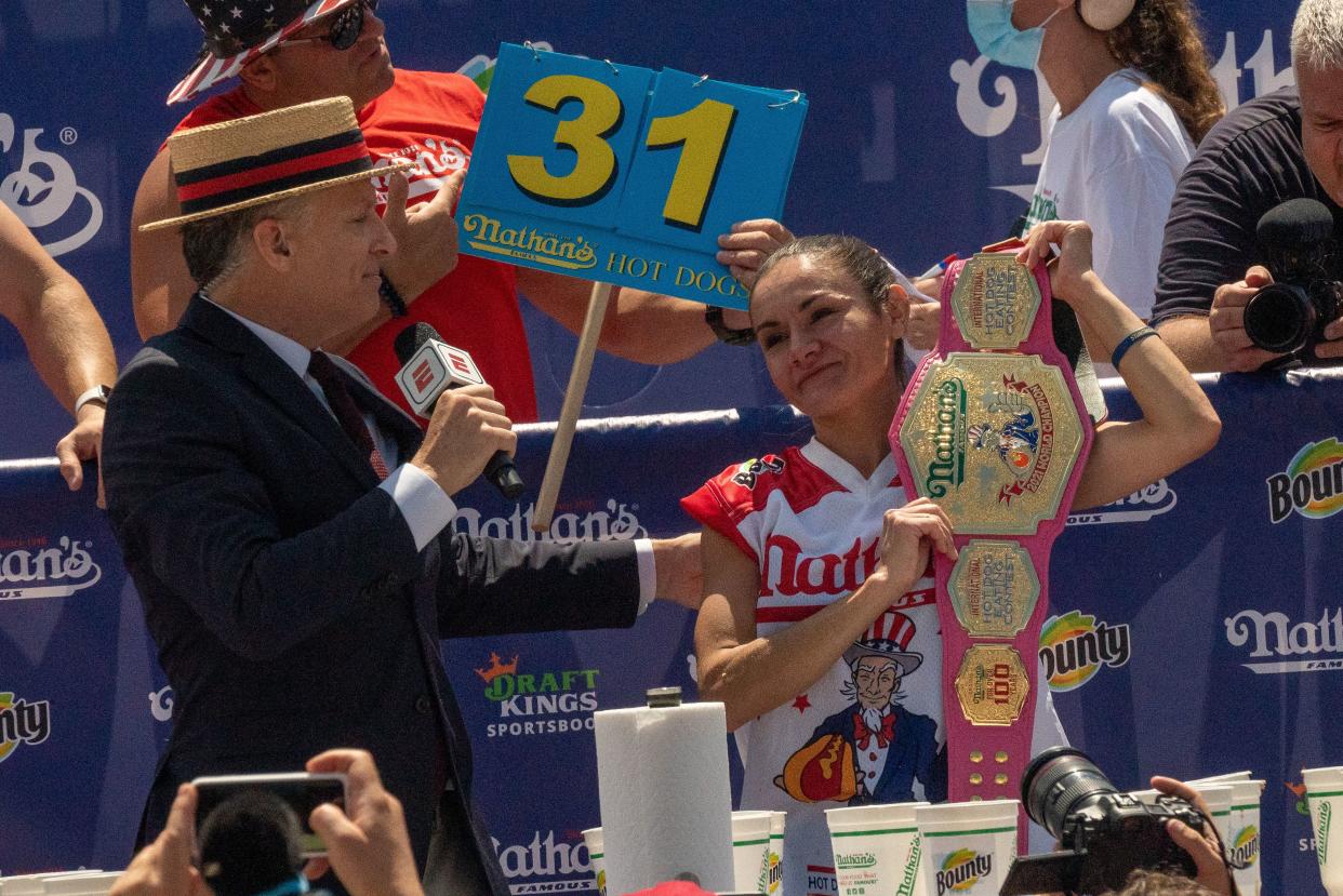 Competitive eating champion Michelle Lesco wins the women's 2021 Nathan's Famous 4th Of July International Hot Dog Eating Contest with 31 hot dogs at Coney Island on July 4, 2021, in New York City.