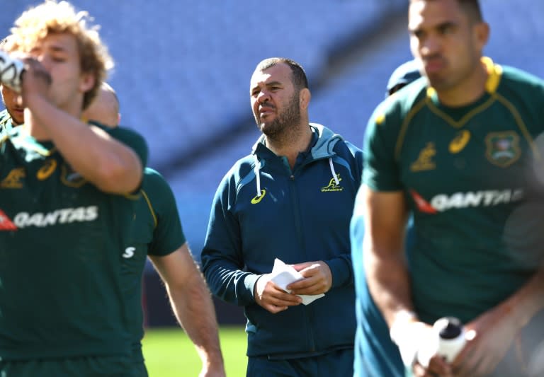 Australian Wallabies rugby coach Michael Cheika (C) looks over his players during the Captain's Run in Sydney on August 18