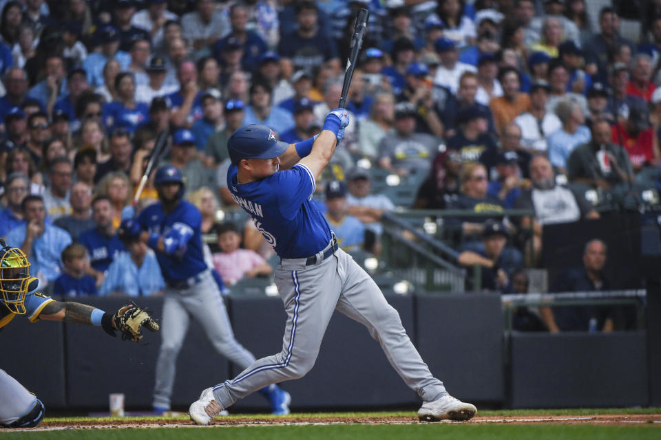 Toronto Blue Jays' Matt Chapman follows through on a three-run double during the second inning of the team's baseball game against the Milwaukee Brewers on Friday, June 24, 2022, in Milwaukee. (AP Photo/Kenny Yoo)