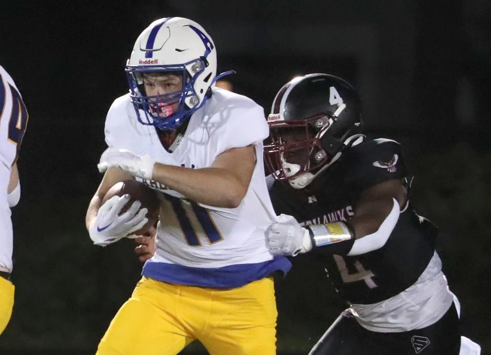 Ardsley's Benjamin Silverman is tackled by Nyack's Sean Clermont during their game at Nyack Sept. 8, 2023. Ardsley won 23-20.