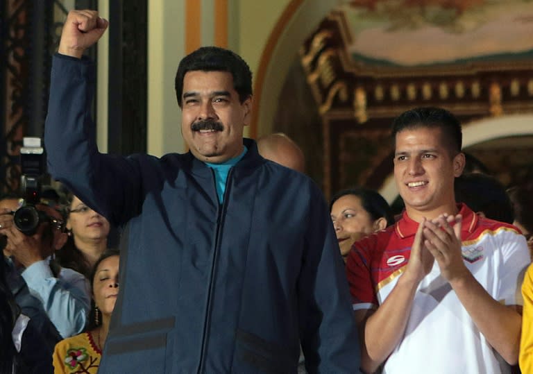 Venezuelan President Nicolas Maduro (L), pictured in Caracas on February 12, 2016