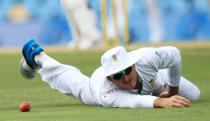 South Africa's captain Graeme Smith, looks on after dropping a catch on the third day of their their cricket Test match against Australia at Centurion Park in Pretoria, South Africa, Friday, Feb. 14, 2014. (AP Photo/ Themba Hadebe)