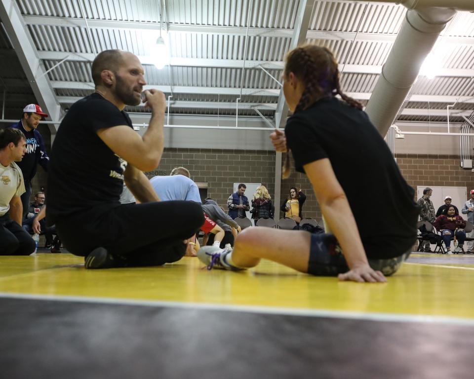 Becca Roper's coach and husband, Lee Roper, coaches her in her first career match on Friday, Oct. 29, 2021, at the StaleMates II competition at the Elwell Family Food Center at the Iowa State Fairgrounds, Des Moines.