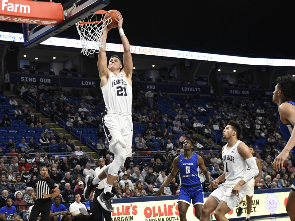 Penn State's John Harrar (21) scores past Central Connecticut's Greg Outlaw (0) and Penn State's Seth Lundy (1) during the first half of an NCAA college basketball game against Central Connecticut State, Friday, Dec. 20, 2019, in State College, Pa. (AP Photo/John Beale)