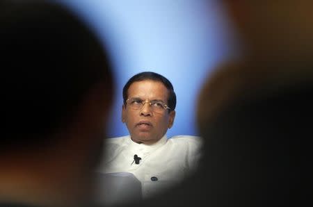 Sri Lanka President Maithripala Sirisena speaks on the podium during a panel discussion at the Anti-Corruption Summit in London, Thursday, May 12, 2016. REUTERS/Frank Augstein/Pool/Files