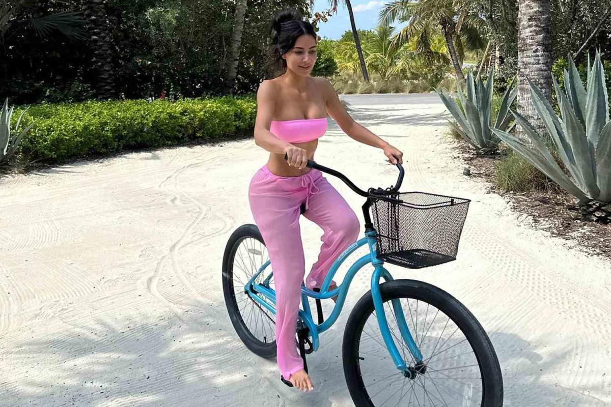 Kim Kardashian Shares Snaps of Hot Pink Beach Attire, Including