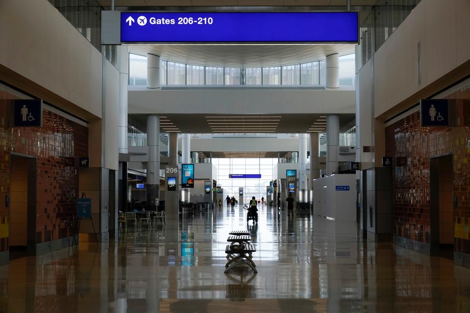 Passengers walk through the new West Gates at Tom Bradley International Terminal at Los Angeles International Airport Monday, May 24, 2021, in Los Angeles. (AP Photo/Ashley Landis) ORG XMIT: CAAL106