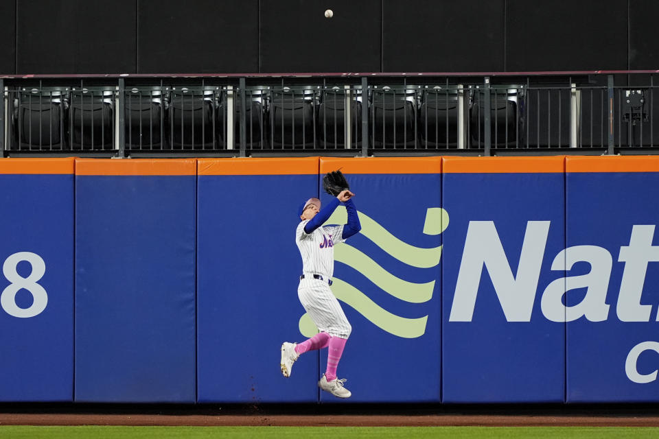 New York Mets outfielder Brandon Nimmo (9) catches a ball hit by Atlanta Braves' Orlando Arcia during the eighth inning of a baseball game, Sunday, May 12, 2024, in New York. The Mets won 4-3. (AP Photo/Julia Nikhinson)