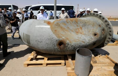 A damaged pipeline is seen at Saudi Aramco oil facility in Khurais