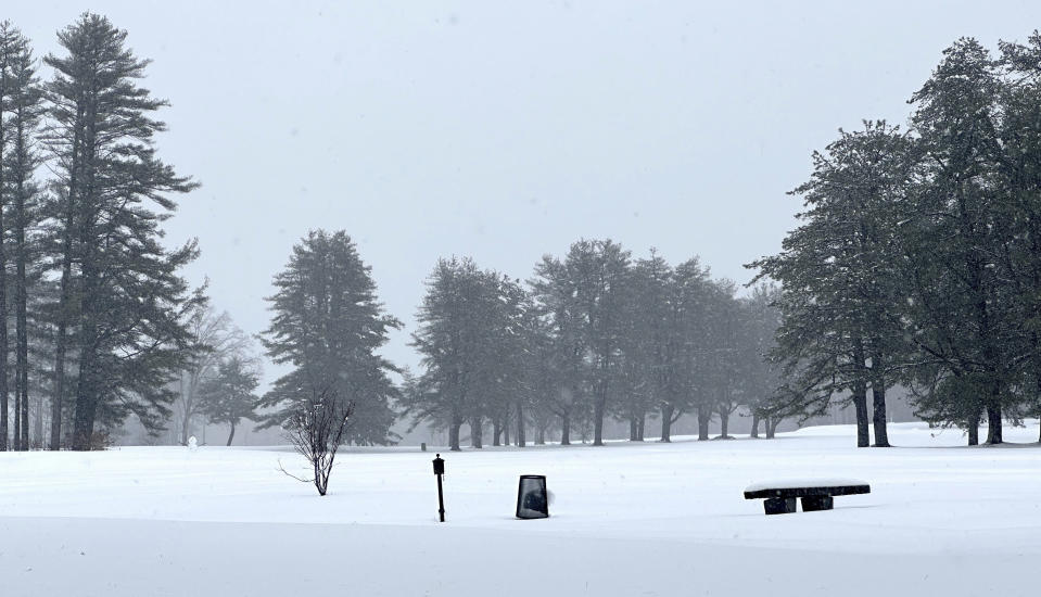 A snowman stands on Beaver Meadow Golf Course in Concord, N.H., Thursday, April 4, 2024. An early spring nor'easter hammered the Northeast with heavy snow, rain and high winds, with some northern areas expected to get up to two feet of snow. (AP Photo/Kathy McCormack)