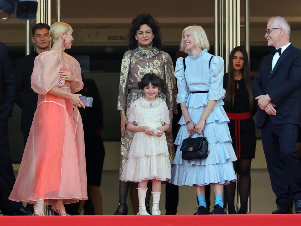 Centre: Freya Anderson and Juman Maloud attend the Asteroid City red carpet during the 76th annual Cannes film festival on 23 May 2023 (Getty Images)