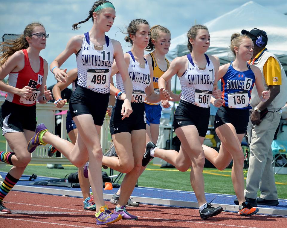 From left, Smithsurg's Cora Gentzel, Ella Fisher, Kayla Hawbecker and Boonsboro's Caroline Matthews run in the Class 1A girls 1,600 during the Maryland State Track & Field Championships at the Prince George's Sports & Learning Complex in Landover, Md., Saturday.