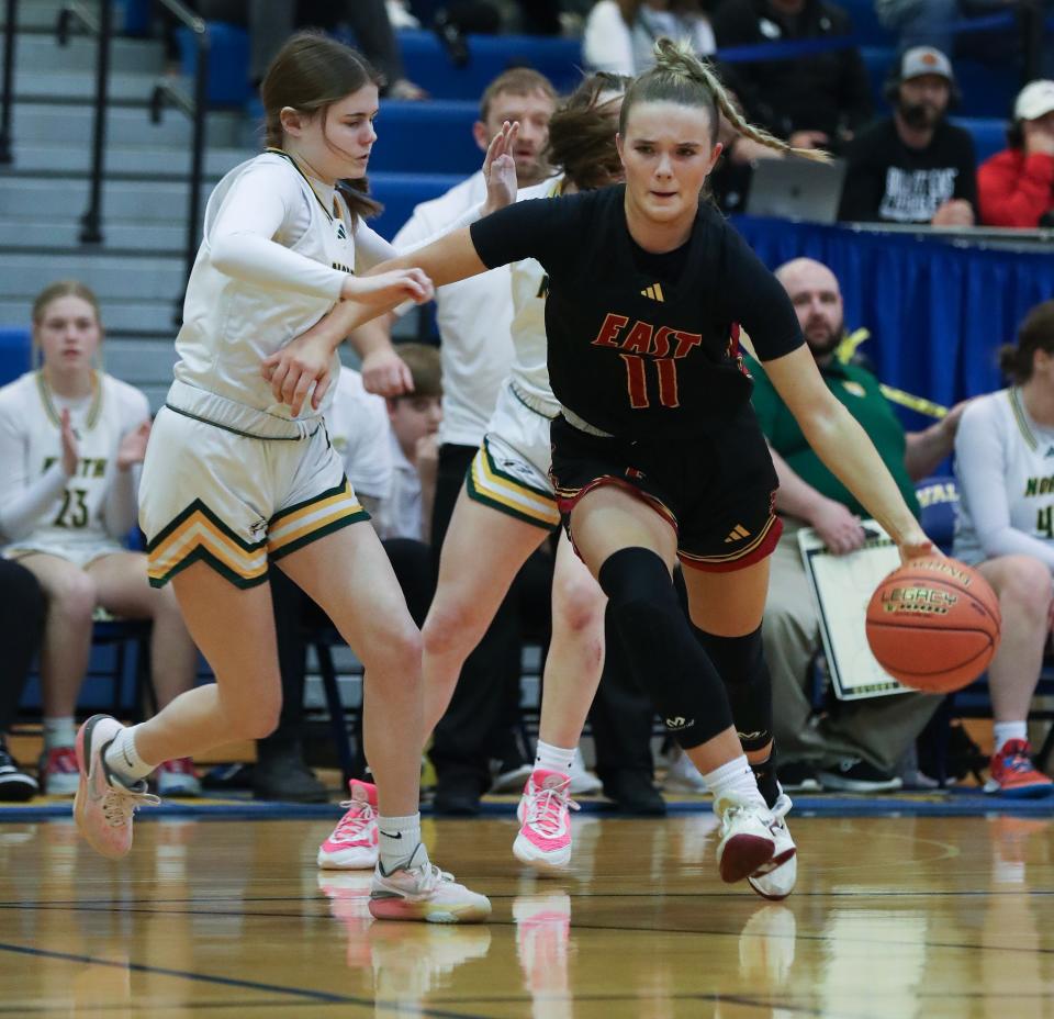 Bullitt East's Anna Rodgers drives against North Bullitt's Taylor Bauer during a Sixth Region semifinal Thursday night.