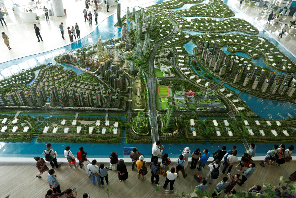 Prospects look at a model of the development at the Country Gardens' Forest City showroom in Johor Baru February 21, 2017. — Reuters pic