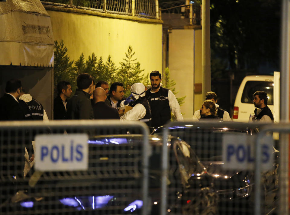 Turkish police officers gather as they prepare to enter the Saudi Arabia's Consulate in Istanbul, Monday, Oct. 15, 2018. Turkish crime scene investigators dressed in coveralls and gloves entered the consulate Monday, nearly two weeks after the disappearance and alleged slaying of Saudi writer Jamal Khashoggi there. (AP Photo/Emrah Gurel)