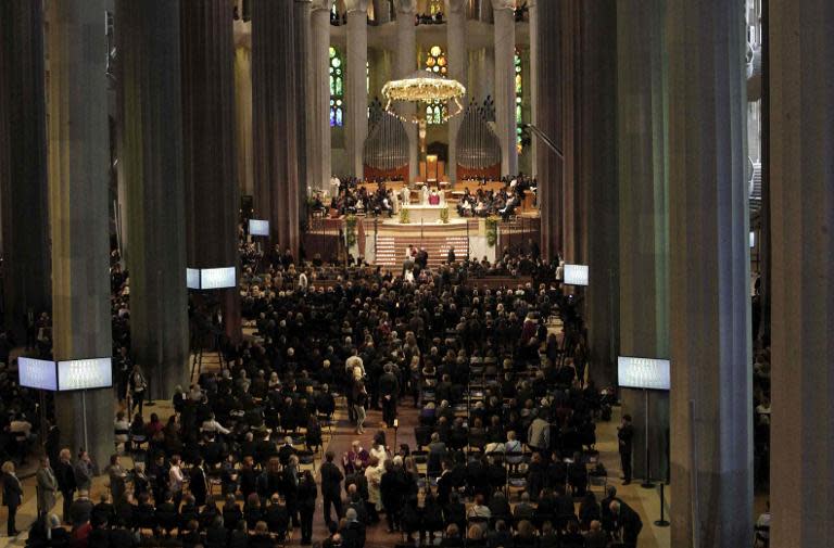 A photo received from EFE shows people attending a memorial mass on April 27, 2015 at the Sagrada Familia's basilica in Barcelona