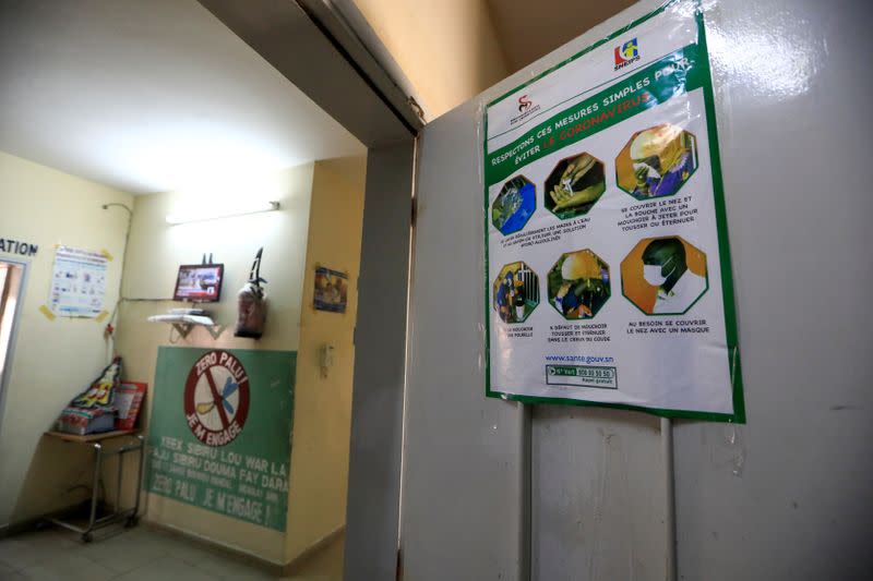 A coranavirus awareness poster is seen at a medical center in Pikine, on the outskirts of Dakar