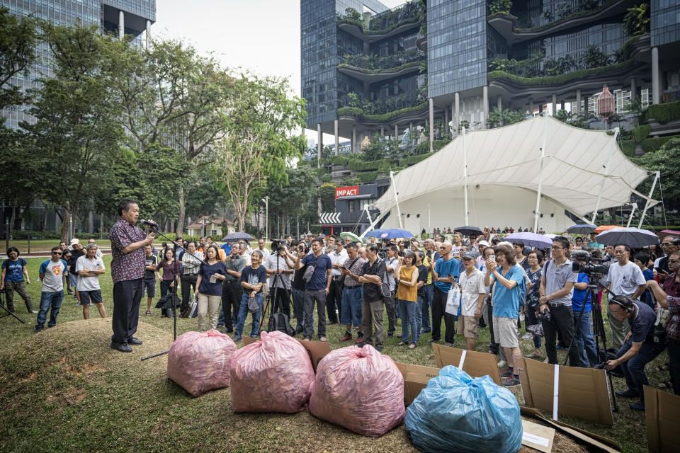 People gather to listen to a speaker during a protest on Hyflux Ltd. debt restructuring plan in Singapore on March 30, 2019. (PHOTO: Bryan van der Beek/Bloomberg via Getty Images)