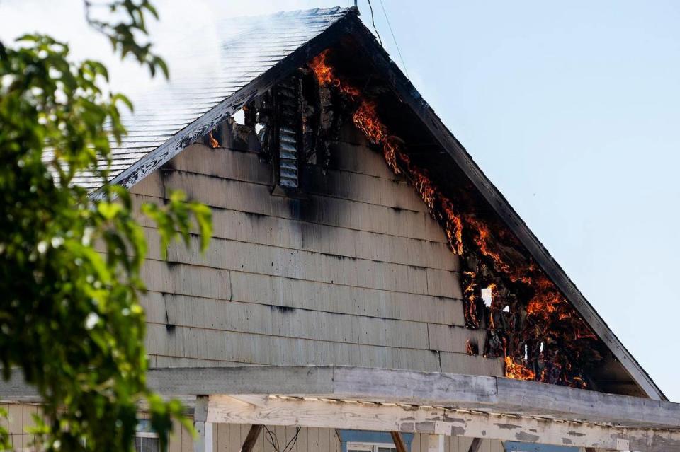 Cal Fire Merced County firefighters and City of Merced firefighters battle a structure fire which damaged two homes in the 1800 block of Dunn Road in Merced County, Calif., on Wednesday, Aug. 23, 2023. Fire officials said the cause of the fire is under investigation.