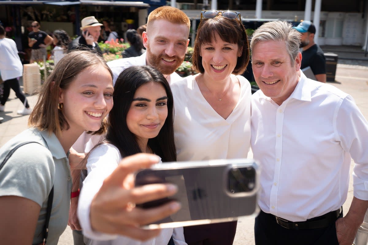 Danny Beales, Rachel Reeves and Keir Starmer campaigning in Uxbridge (PA)