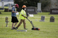 FILE - In this July 17, 2020, file photo, workers use ground penetrating radar as work continues on a search for a potential unmarked mass grave from the 1921 Tulsa Race Massacre, at Oaklawn Cemetery in Tulsa, Okla. A second excavation begins Monday, Oct. 19, 2020, at a cemetery in an effort to find and identify victims of the 1921 Tulsa Race Massacre and shed light on violence that left hundreds dead and decimated an area that was once a cultural and economic mecca for African Americans. (AP Photo/Sue Ogrocki File)