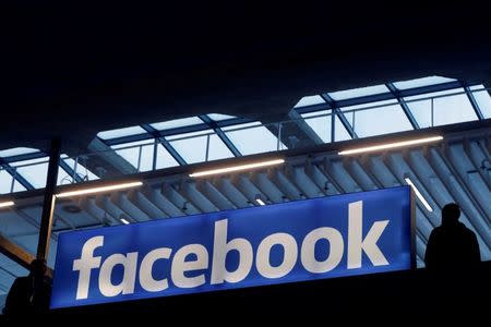 Facebook logo is seen at a start-up companies gathering at Paris' Station F in Paris, France on January 17, 2017. REUTERS/Philippe Wojazer/Files